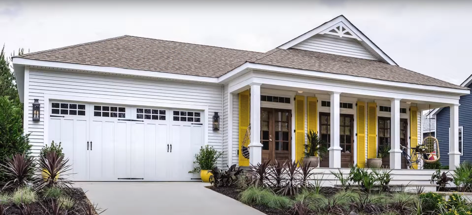 A technician repairing a residential garage door.