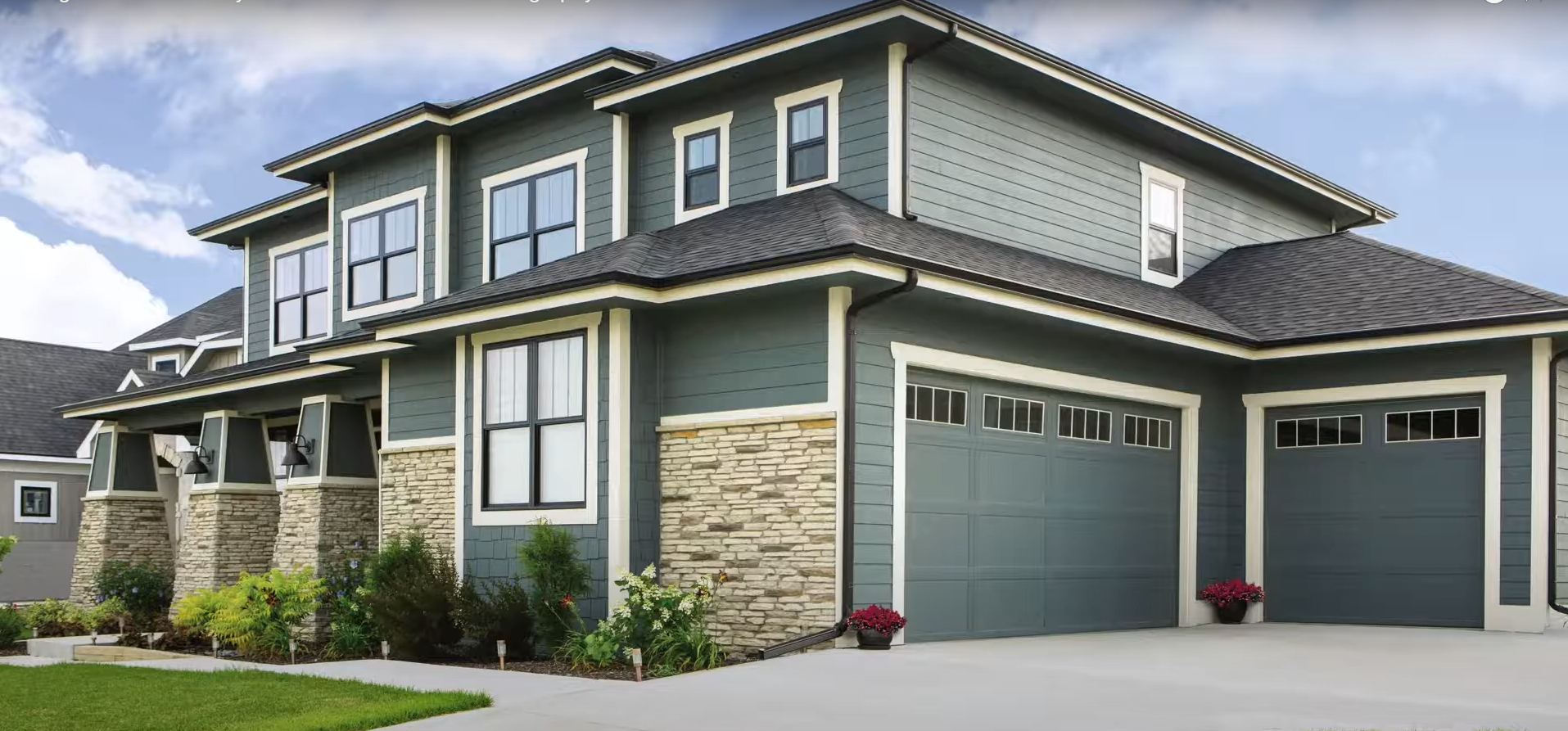 An image of a modern custom garage door with a sleek design, showcasing durable materials and a personalized finish.