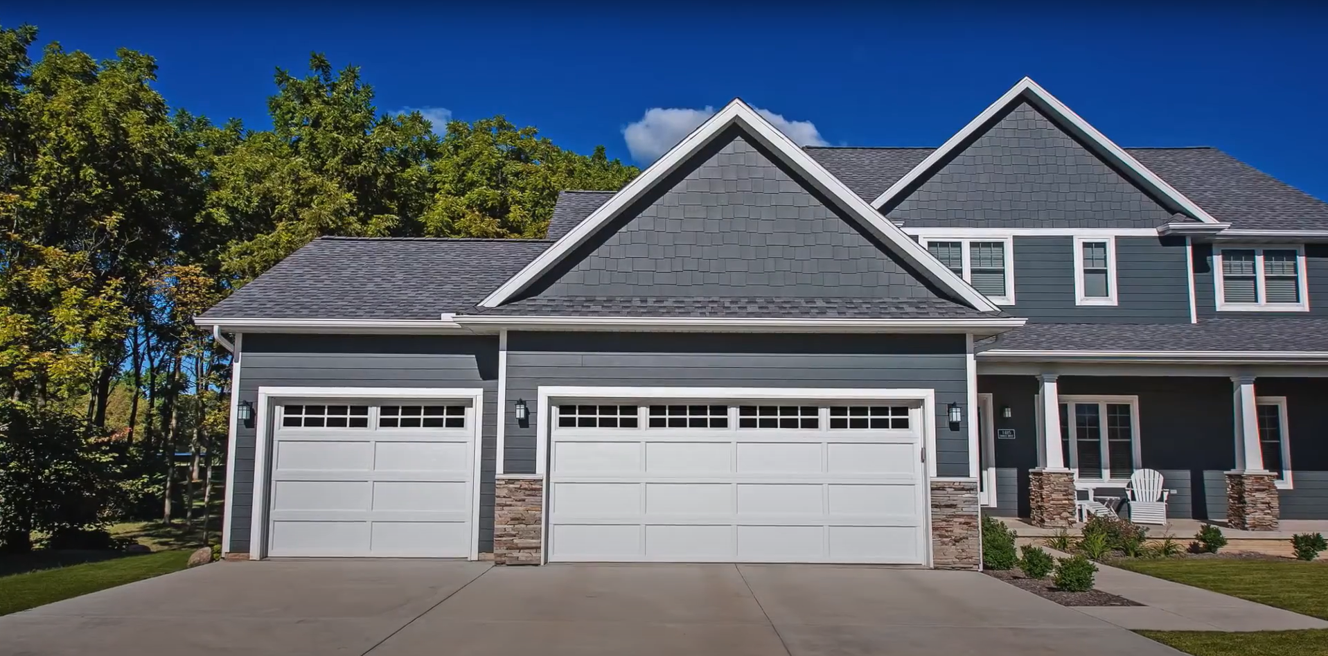 A technician repairing a residential garage door.